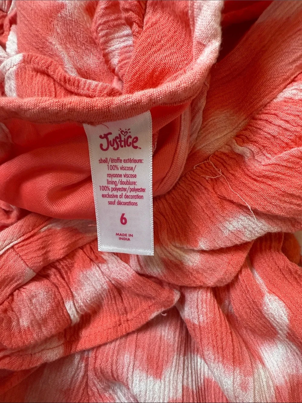 Justice Coral and White Tie-Dye Romper with Ruffle Shoulders